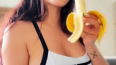 Busty babe playing with her big boobs